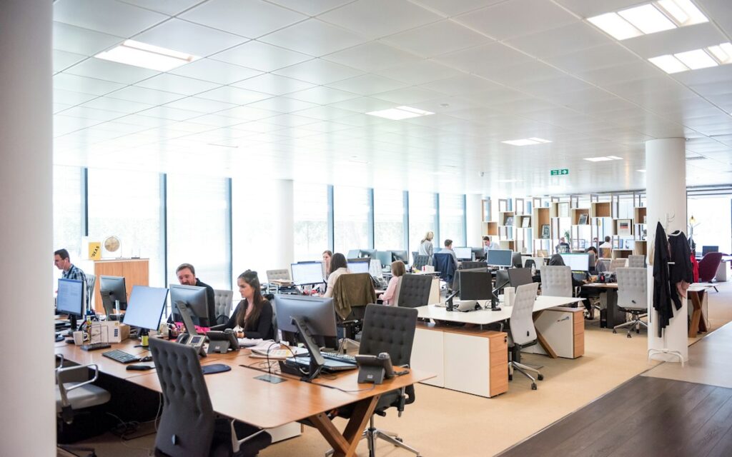 Busy open-plan office with staff at their desks