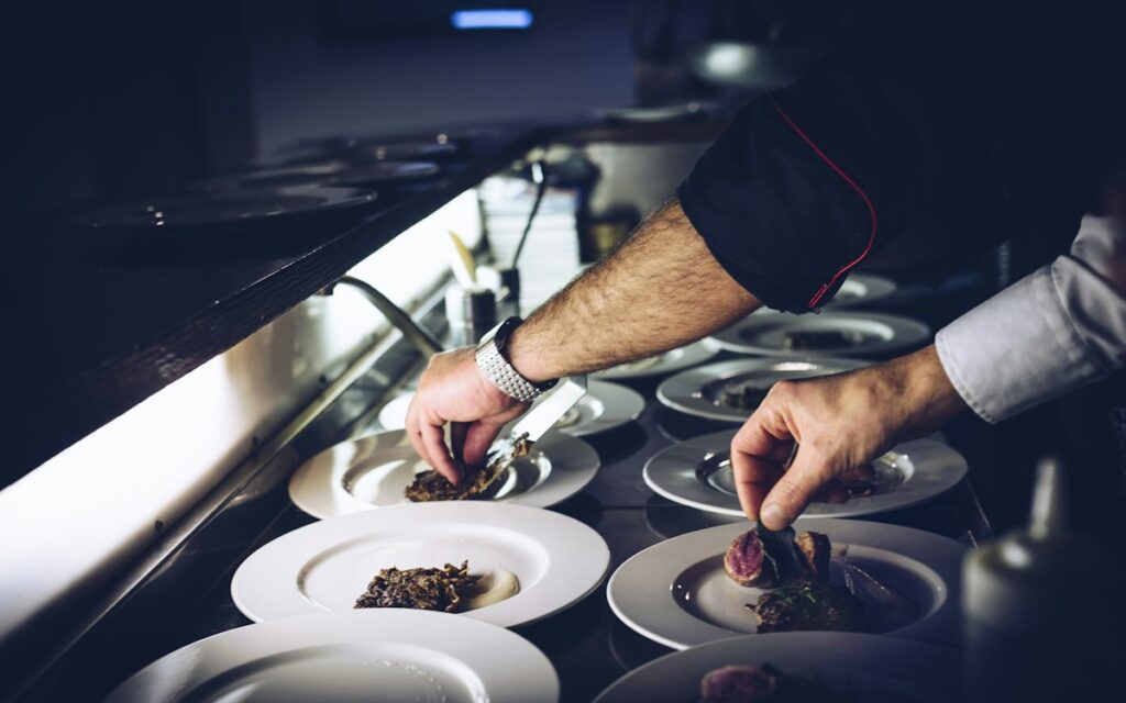 Chef plating dishes in a professional kitchen