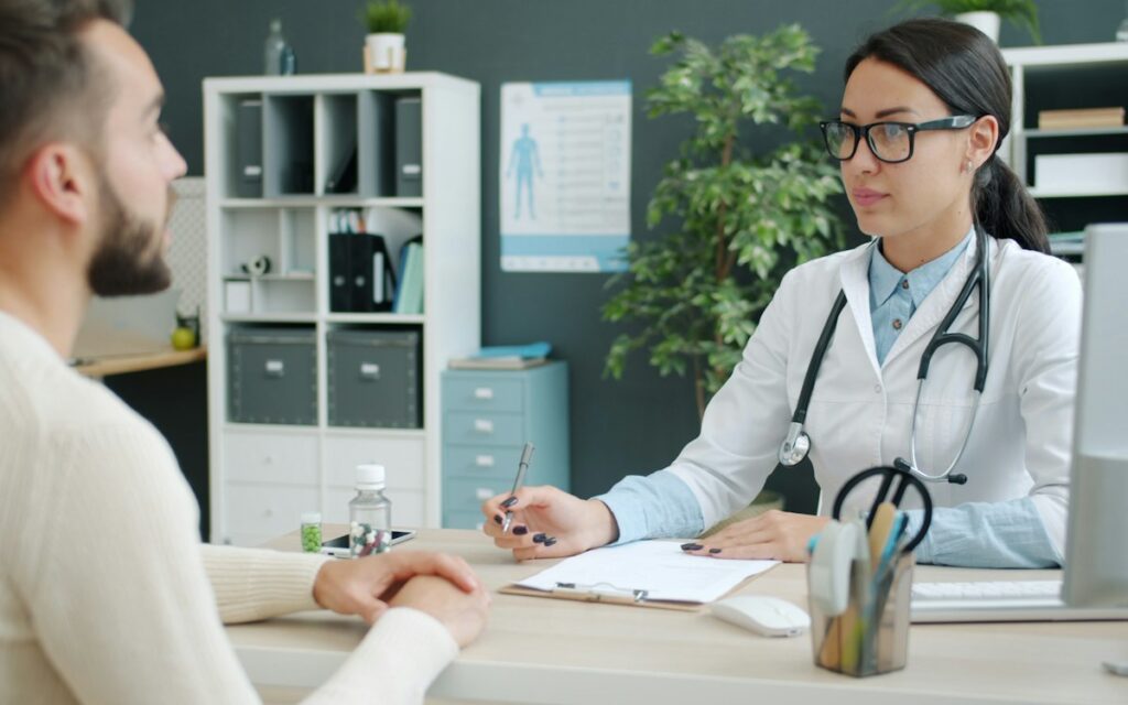 Doctor consulting a patient in a clean consulting room