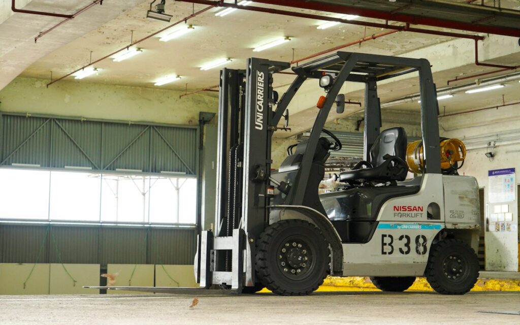 Forklift truck working inside a warehouse