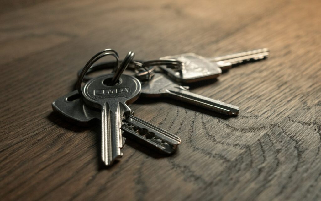 Set of keys on a wooden table ready for handover