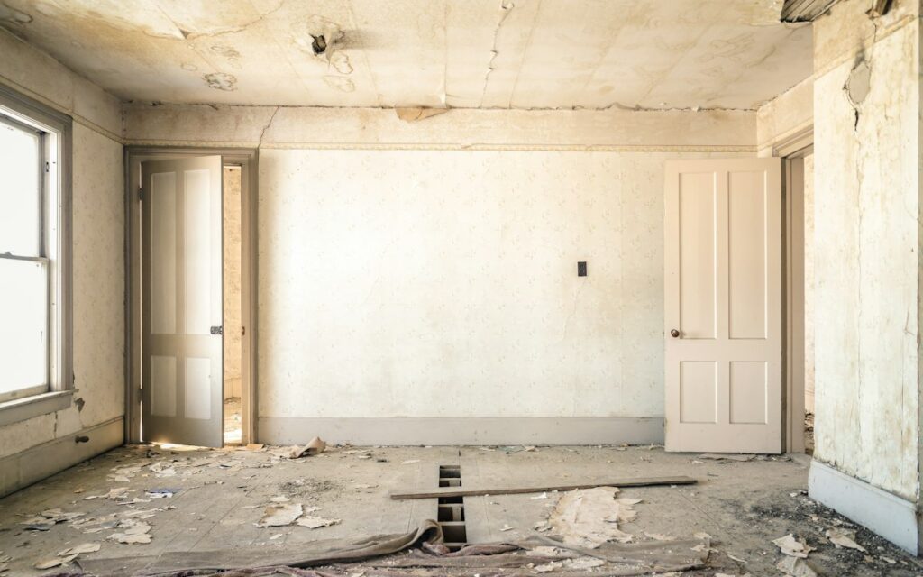 Room under renovation with dust and debris